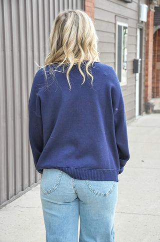 This stitch detailed solid sweater in a rich navy or beautiful plum, is one of those wardrobe-building pieces you'll reach for all season long.