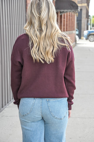 This stitch detailed solid sweater in a rich navy or beautiful plum, is one of those wardrobe-building pieces you'll reach for all season long.