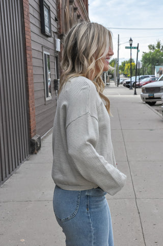 This textured stripe button-down crew neck cardigan in a soft taupe/sage is the kind of layering piece you'll reach for all season long.